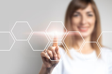 young girl points a finger at the virtual screen, icons are added on a light background. Banner. Concept business and digital technology