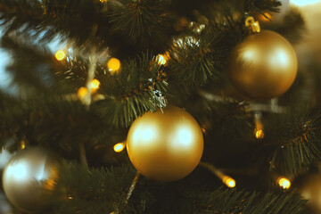 Obraz na płótnie Canvas Large silver and gold Christmas balls on a fur-tree