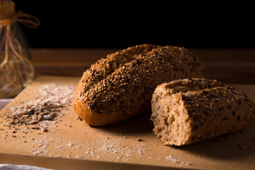 multigrain wholemeal bread with seeds on brown wooden table