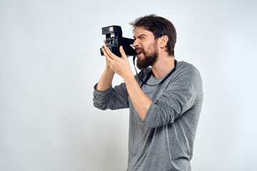 Obraz premium Male photographer professional camera work Studio Technology modern art light background