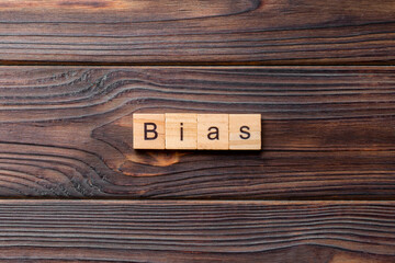 BIAS word written on wood block. BIAS text on wooden table for your desing, concept