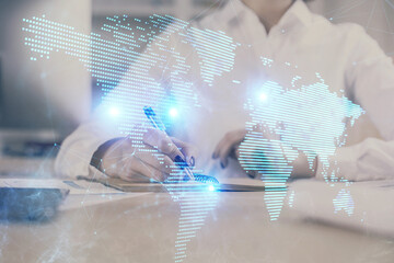 Social network theme hologram over woman's hands writing background. Concept of international people connect. Double exposure
