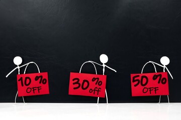 Stick man figure holding red sale and promotion sign poster. Black friday sale percent off and...