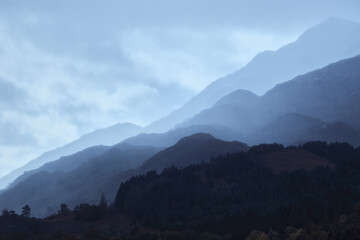 Beautiful morning scottish landscape with tonal perspective in blue tonality. Glenfinnan, Scotland, United Kingdom