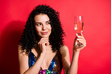 Close-up portrait of gorgeous pretty cheerful wavy-haired girl drinking wine thinking wish dream isolated on bright red color background