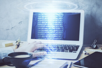 Double exposure of data internet theme hologram with man working on computer on background. Concept of innovation.