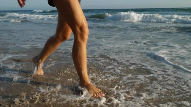 Attractive woman walking along the beach in Southern California