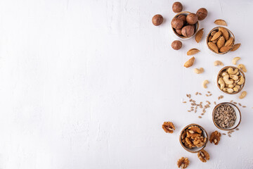 Fototapeta na wymiar Nuts assorted on white background. Top view