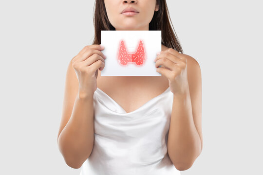 Illustration of the thyroid in the white paper is on the woman's neck. Female thyroid gland control. Sore throat of a people against a light gray background