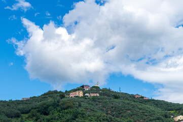 Fototapeta na wymiar view of Saint Giulie's church and hill from Lavagna, Italy