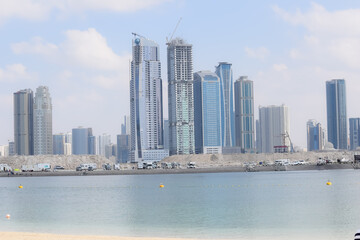 Fototapeta na wymiar Amazing view of Dubai city flat buildings near the sea