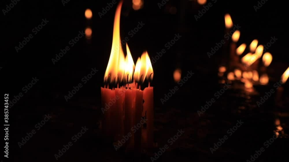 Wall mural burning candles in the church