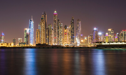 View of A Dubai Marina at night. Shot made from Palm Jumeirah, man made island. Dubai, UAE.