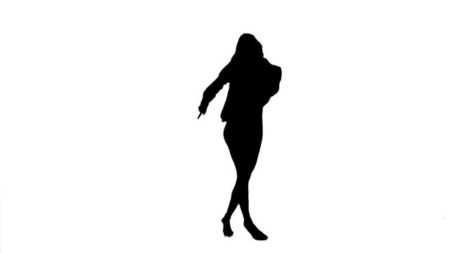Silhouette. Professional dancer performs a choreographed dance over white background.
