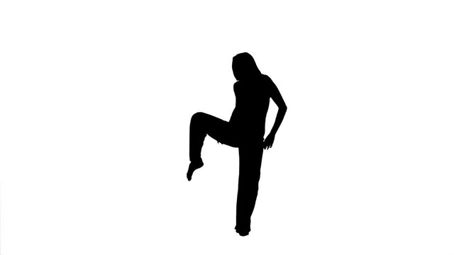 Silhouette. Professional dancer performs over white background, slow tempo.
