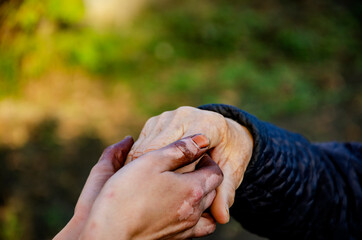 Cohesion. The power of friendship. No racism concept. The dark spotted hand is held with the white...