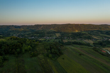 Fototapeta premium Hill landscape, in Eastern Europe, at sunset