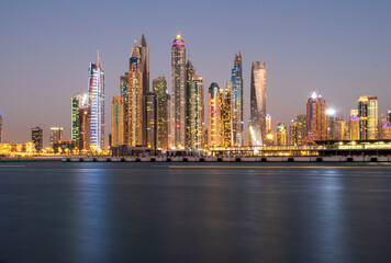 View of A Dubai Marina after sunset. Shot made from Palm Jumeirah, man made island. Dubai, UAE.
