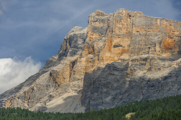 Sasso di Santa Croce range west vertical wall & Mount Cavallo in eastern Dolomites, dominating Badia valley, as seen from La Villa village, Alta Badia, Trentino, Alto-Adige, South Tyrol, Italy.  