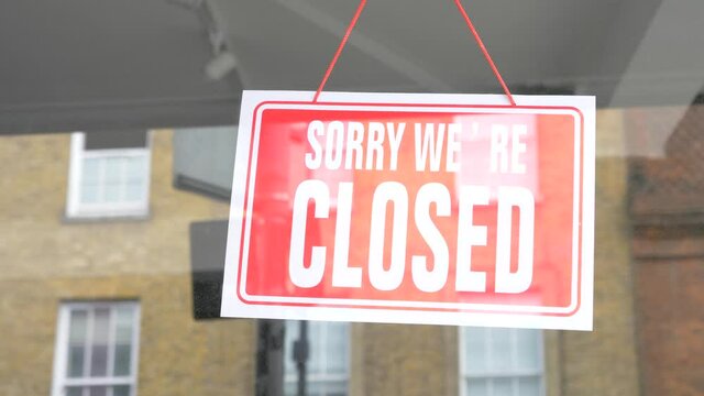 Sorry closed sign on shop entrance in London - Business closed due to coronavirus pandemic - background image about closed shops and restaurants in the city