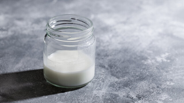 Dairy-free Greek Yogurt Kefir With Coconut Milk In Glass Jar On Gray Background. Healthy Probiotic Drink