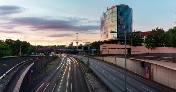 Sunset time lapse day to night with city highway and cars