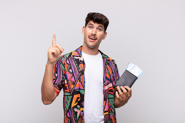 young tourist with a passport feeling like a happy and excited genius after realizing an idea,...