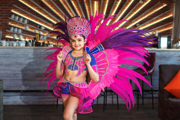 beautiful caucasian girl in traditional carnival  dancer costume. looking straight. dancing girl. 