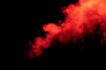 Movement of red smoke on black background.