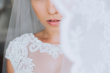 Close up photo of bride young woman with bright trendy lips.