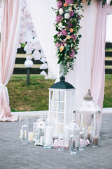 Floral details of wedding ceremony outdoors. Close up of floral bouquets and compositions.