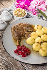Roasted duck leg.