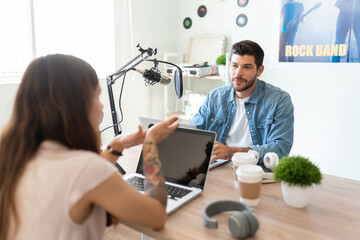 Broadcaster and guest in a discussion