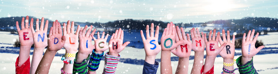 Children Hands Building Colorful German Word Endlich Sommer Means Finally Summer. White Winter Landscape With Snow As Background