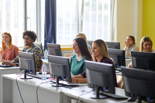 Group of students at an informatics lecture. Smart young people study at the college. Education, college, university, learning and people concept