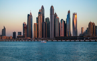 Plakat View of A Dubai Marina during sunset hour. Shot made from Palm Jumeirah, man made island. Dubai, UAE