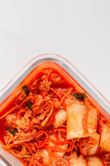 Homemade Kimchi (Korean food) isolated on white background. Kimchi cabbage in a bowl plate, Korean food. 