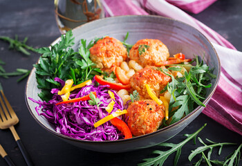 Italian pasta. Cavatappi with meatballs and salad on dark background. Dinner. Slow food concept