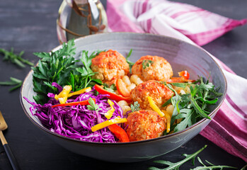Italian pasta. Cavatappi with meatballs and salad on dark background. Dinner. Slow food concept