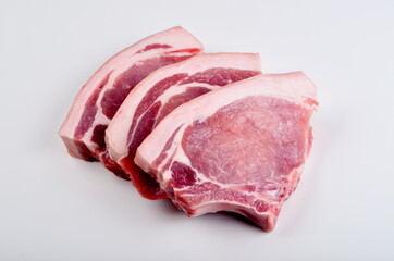 Sliced raw pork steak isolated on white background. Top view