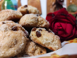 Homemade cottage cheese cookies with raisins sprinkled with sugar close-up.