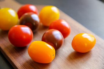 Cocktail tomatoes on a cutting board
