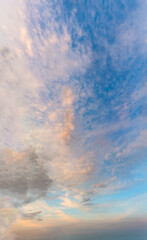 Fantastic clouds at sunrise, vertical panorama