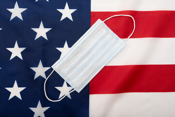 Surgical mask, medical mask on flag of the USA flag, concept picture