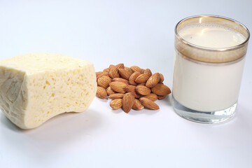  almond nut, cheese and milk on white background 