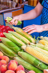 Fresh organic fruits vegetables and corn. Harvest of peaches, peppers and corn on the counter of the farmers ' market in Yalta