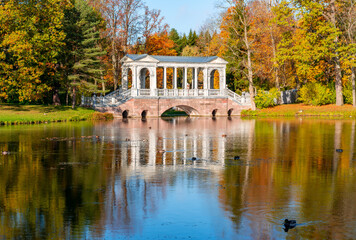 Marble bridge in autumn foliage in Catherine park, Pushkin (Tsarskoe Selo), Saint Petersburg, Russia