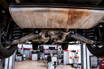 Close up of car on a lift in a car repair service