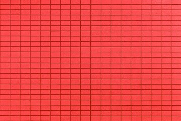 Red stone block wall seamless background and pattern texture