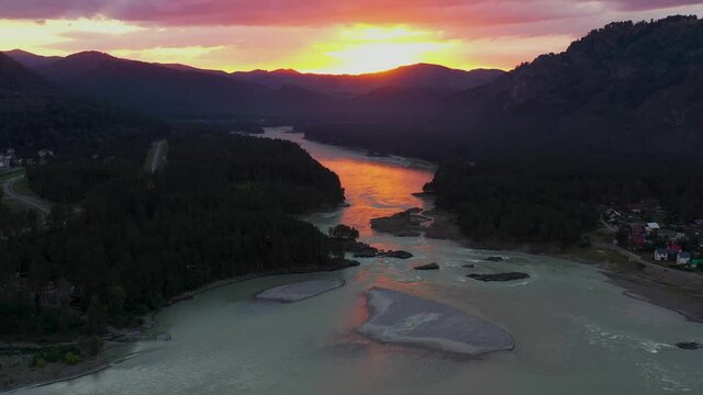 The mountain river view from high. Mountain landscapes. Pink sunset